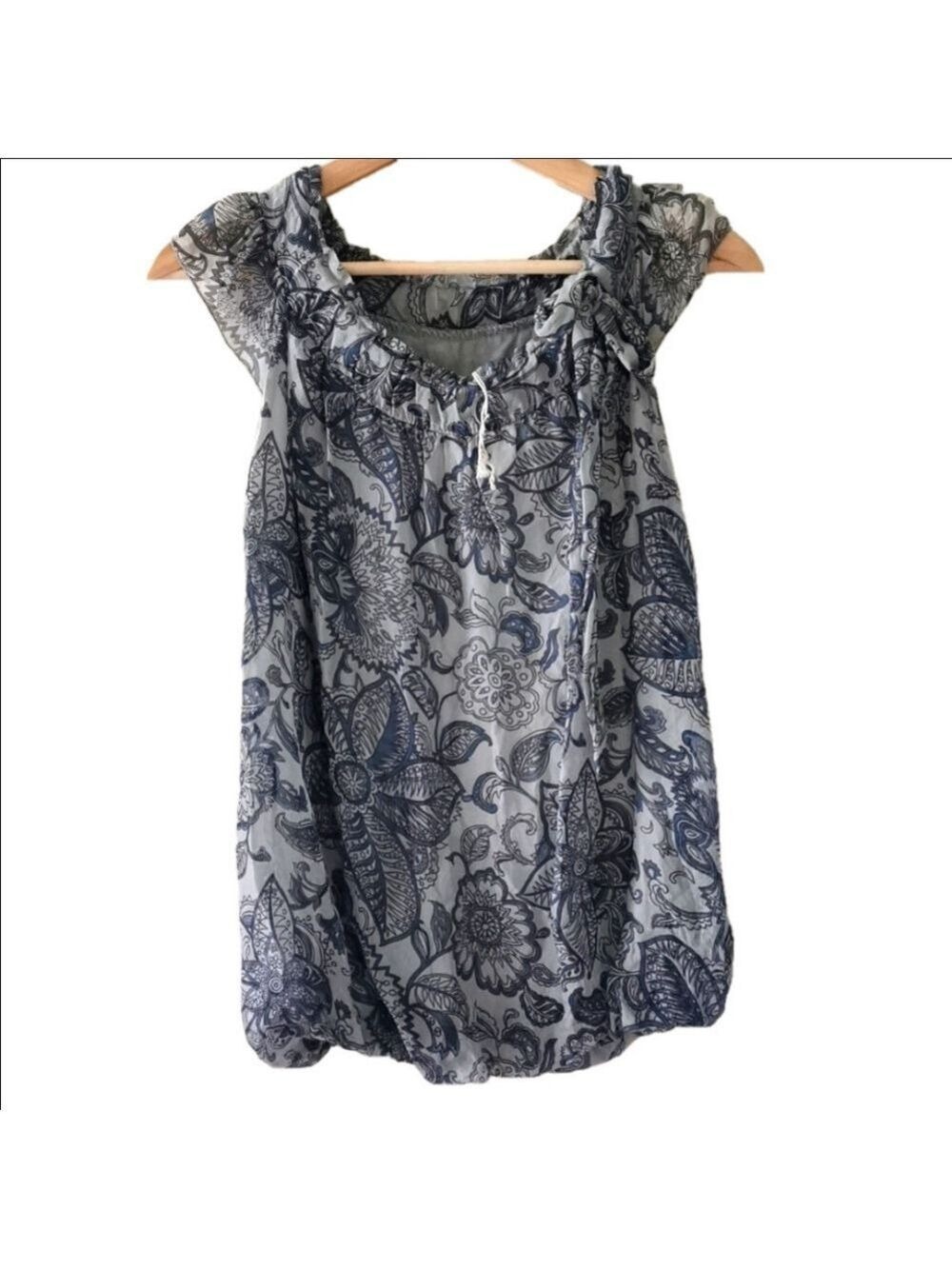 Gusy silk floral sleeveless blouse. Never worn. Size small.